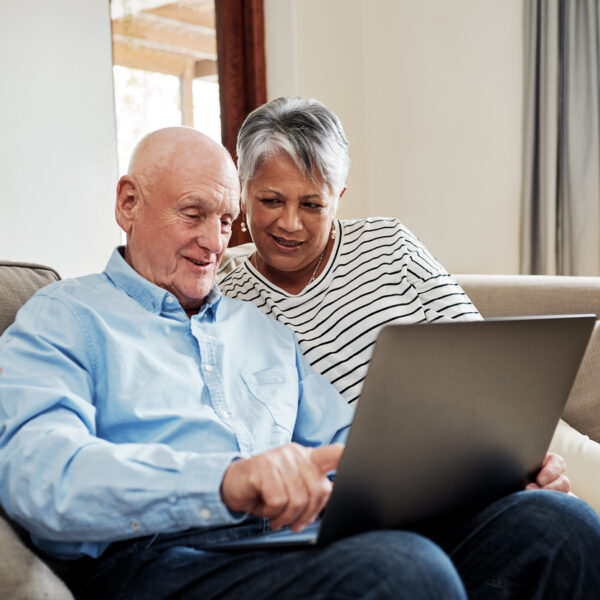 Couple use a laptop together