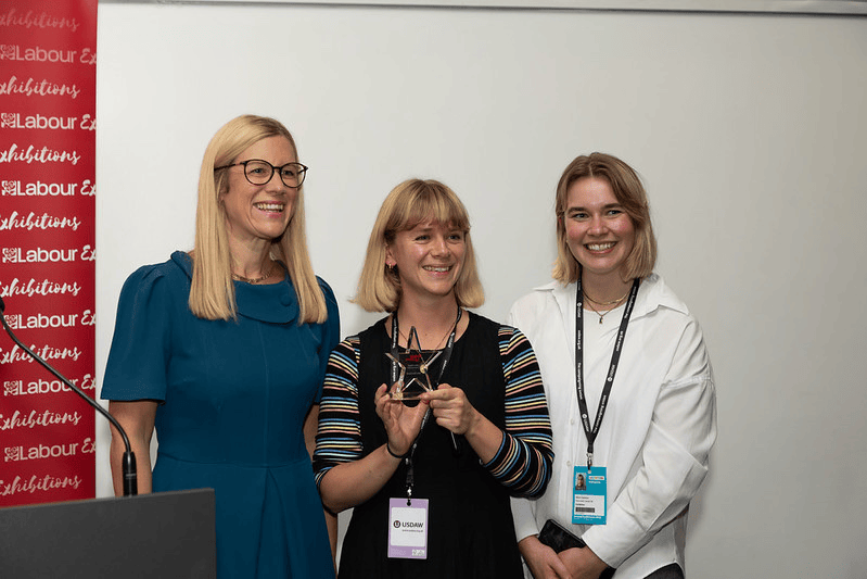 Emily and Alice collecting our award for best new stand at Labour conference