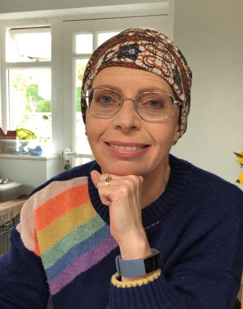 Woman with headscarf smiling to camera