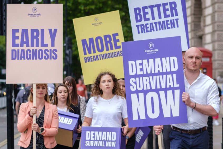 Campaigners on a march demanding survival for people with pancreatic cancer