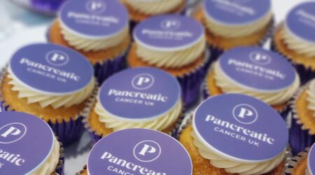 Cupcakes with Pancreatic Cancer UK logo branded on top of the icing