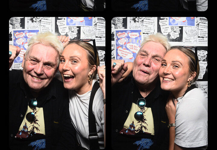 Father and daughter in photo booth